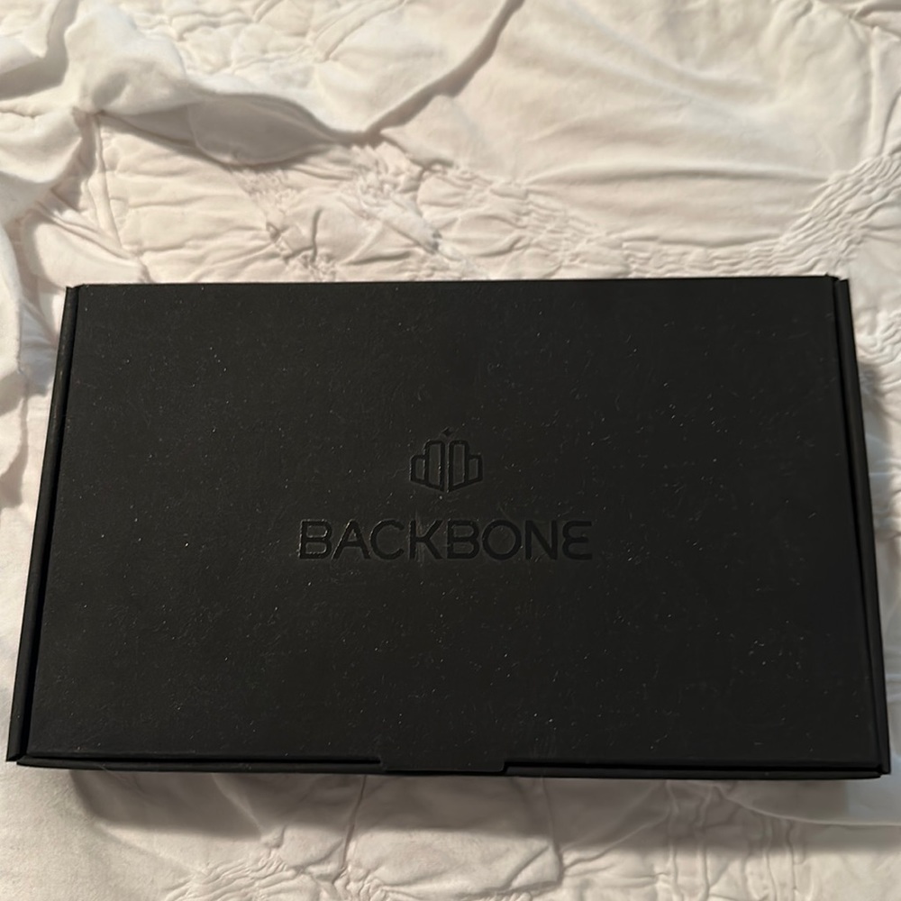 Backbone - essentially unused - box / instruction manual included